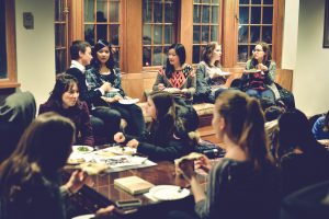 Undergraduates and graduate student participants enjoying an informal pizza dinner in the Philosophy Department lounge at Princeton. 