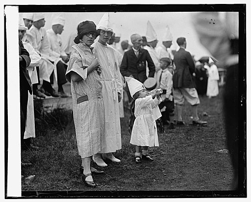 historical black and white photograph of women and children at KKK event