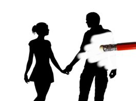 silhouette images of a woman and man with the man being erased by a pencil