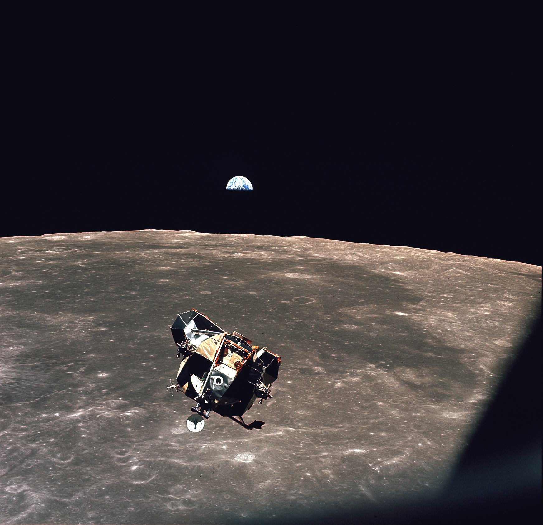 The Apollo 11 lunar module, the Moon, and the Earth The Apollo 11 lunar module, the Moon, and the Earth