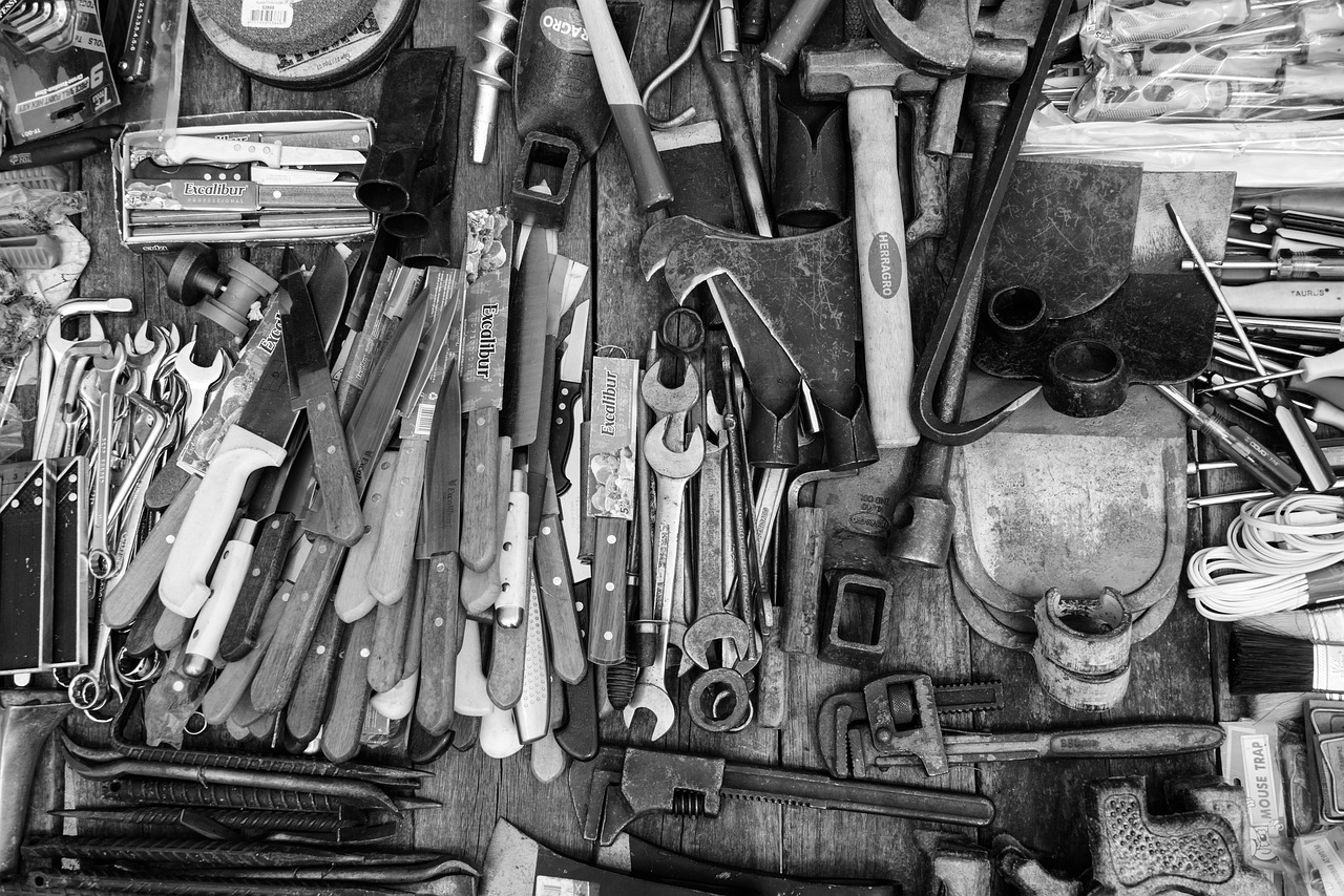 A greyscale picture of tools laid out on a work table